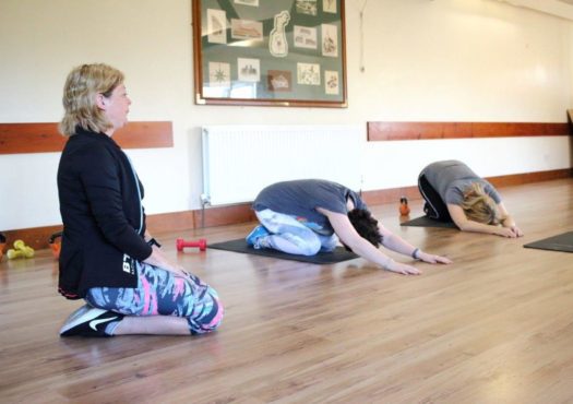 Instructor leading a group exercise session