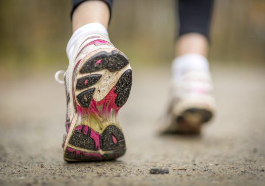 Closeup of a runner running in a park