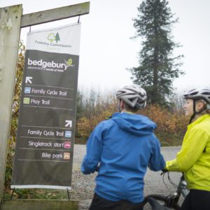 A couple cycling at Bedgebury Forest