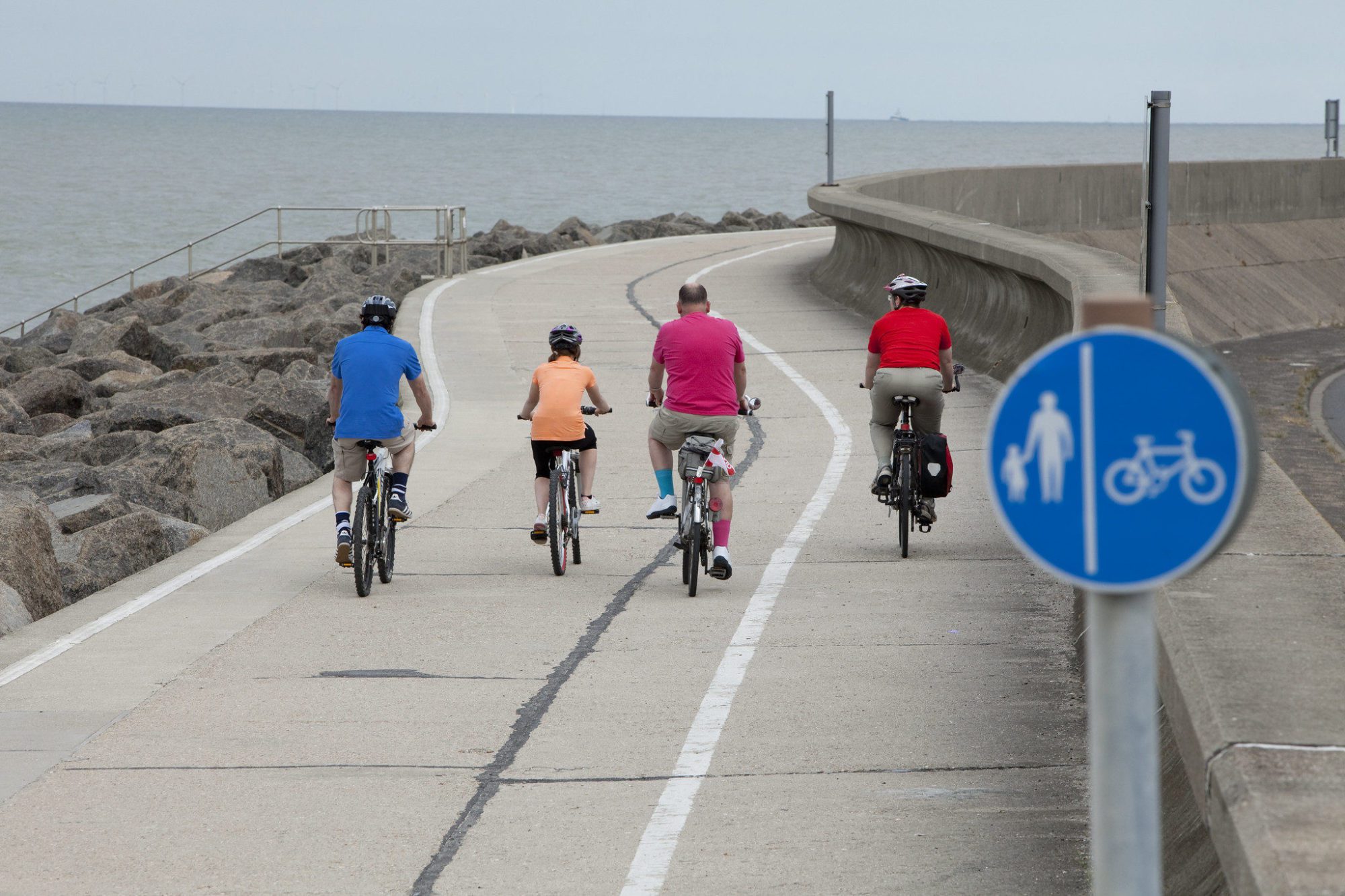 Cyclist on coastal path on Sheppey