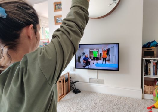 Woman doing an exercise class at home