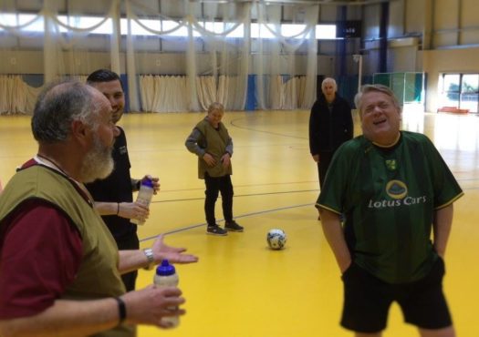 Walking football teammates talking