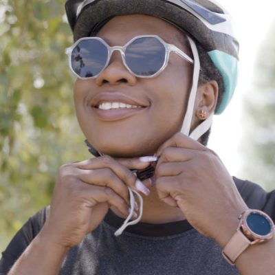 Abi putting on her helmet