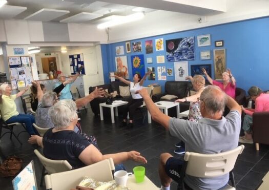 people seated exercising