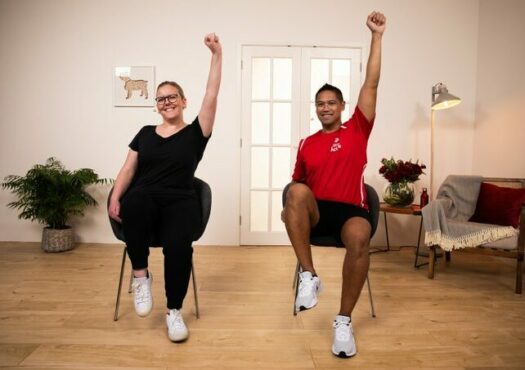 two people doing seated exercise