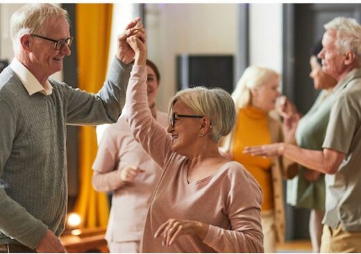 older people dancing in a hall