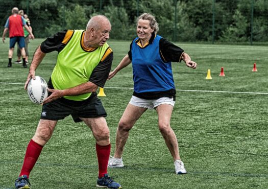 two people playing walking rugby