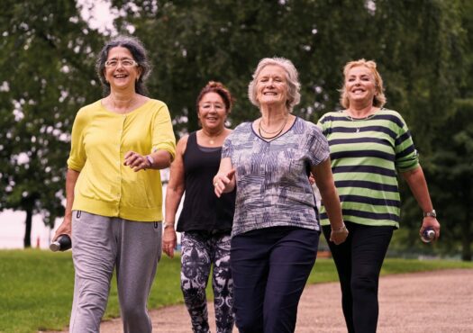 four ladies walking in the park