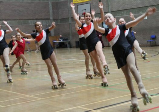 girls on roller skates in sports hall