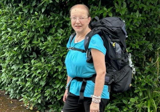 Karen walking with a backpack