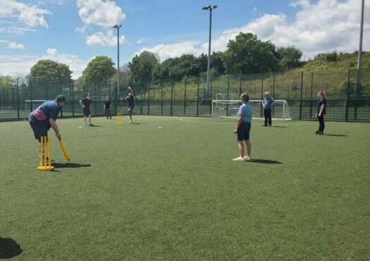 people playing walking cricket