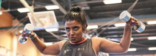 woman lifting weights in a gym