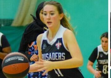 young girl playing basketball