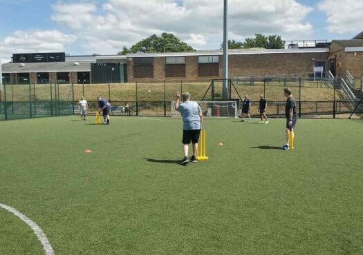 people playing walking cricket