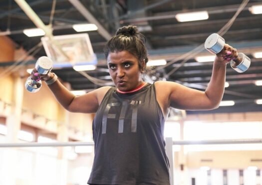 woman lifting weights in a gym