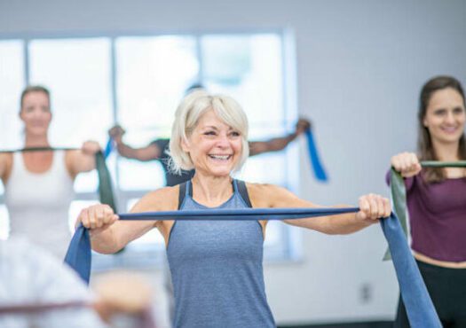 Photo of woman using resistance band