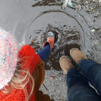 feet in a puddle of water