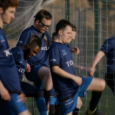 Spencer warming up on the football pitch