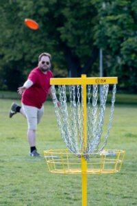 Playing disc golf